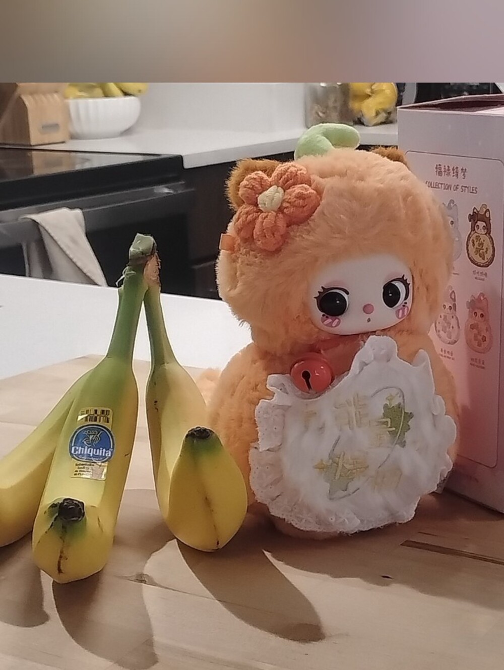 Confirmed Baby Three Good Baby Orange Plush Doll with Apron and Floral Accent